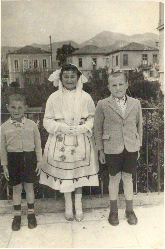 Left to Right: Dino, My mom, and Nick on Greek 
Independence Day in Tripoli, 1958